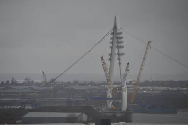 DAY TWO - New Wear Crossing central pylon is raised into place.