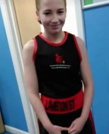 Josie King in her boxing kit, pictured before she became ill.