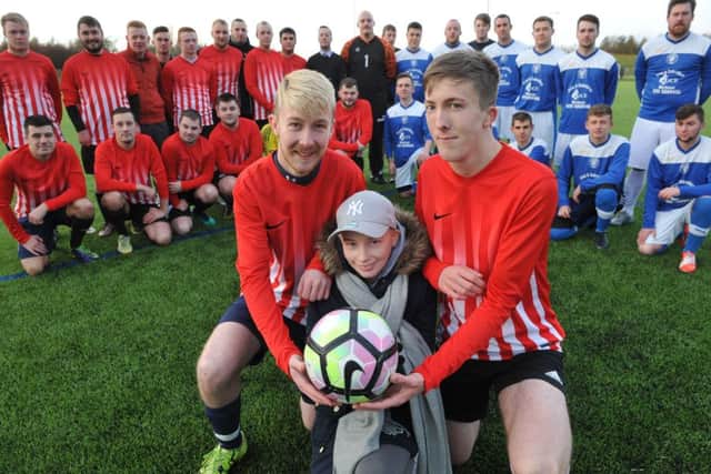 Ryan and Louis Doneathy with their cousin Josie King pictured  at their charity football match at Silksworth Sports Complex.