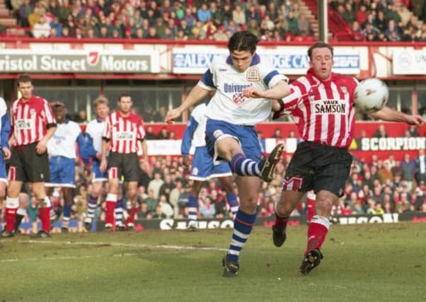 Kevin Ball loses out as Lutons Ceri Hughes clear the visitors lines at Roker Park in February 1996. Pictures by Malcolm Murray