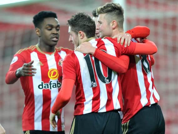 The Sunderland players celebrate Ethan Robson's opening goal.