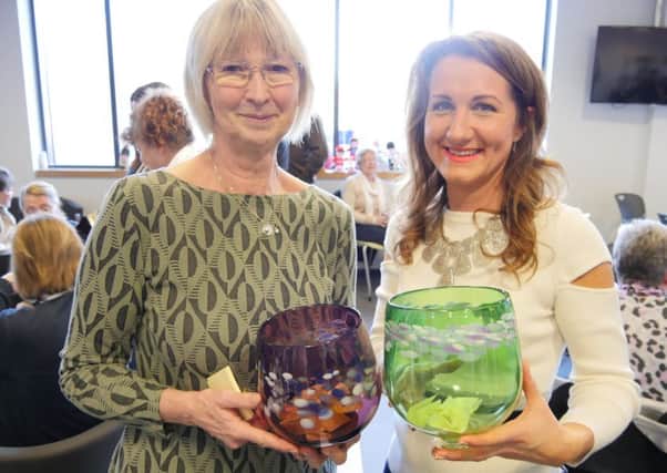 Jennifer Bell and Julia Errington with vases donated by The National Glass Centre.