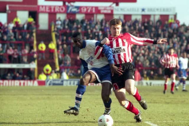 Craig Russell grafts against Luton in 1996