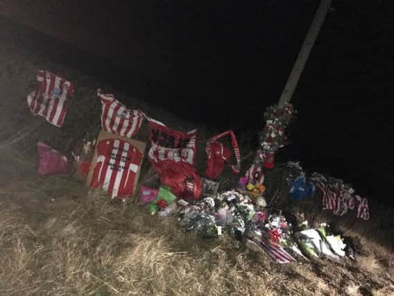 Tributes left at the roadside where Stuart Price died.