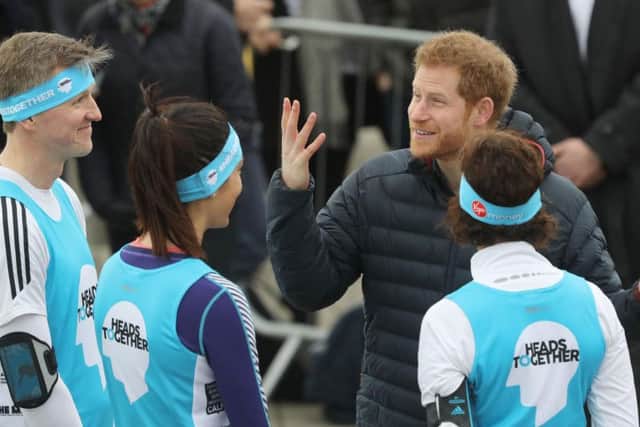 Prince Harry has a laugh with runners during his visit to the North East.