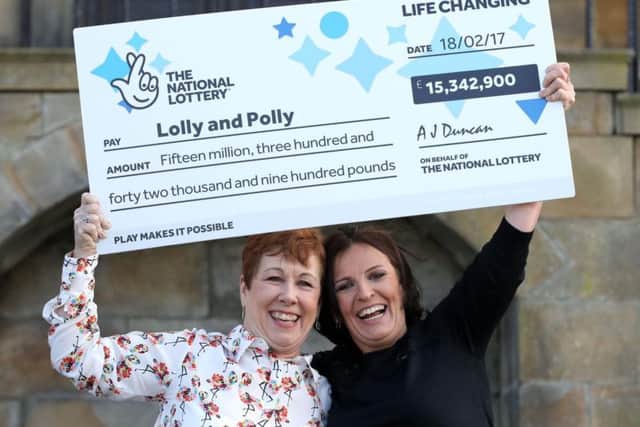 Best friends Paula Barraclough, left, and Lorraine Smith celebrate at the Lumley Castle hotel after scooping the 15million jackpot.