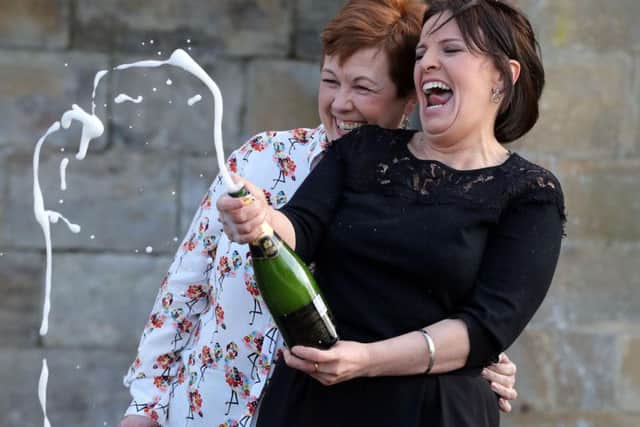 Paula Barraclough and Lorraine Smith celebrate with champagne after winning the 15million Lotto jackpot.