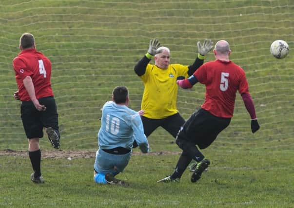 Rolls-Royce (blue) score against Willow Pond in last week's Over-40s League clash. Picture by Kevin Brady