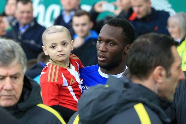 Bradley Lowery when he was carried on to the pitch by Everton's Romelu Lukaku before the Premier League match at Goodison Park, Liverpool, in January.