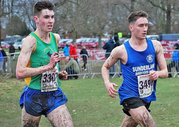 Sunderland Harrier Jack Tallentire (right) fights to the finish in the junior men's race at the National Cross Country Championships in Nottingham