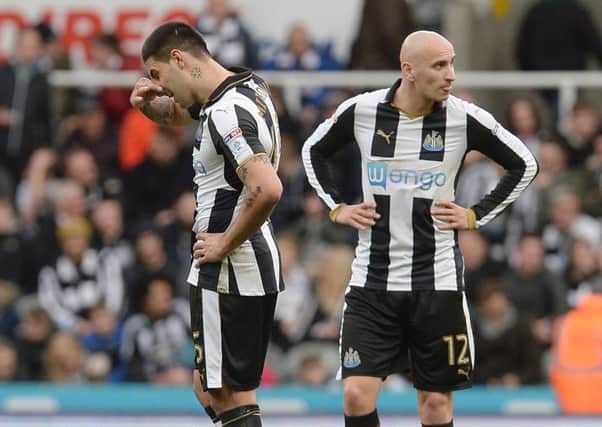 Dejected Aleksandar Mitrovic and Jonjo Shelvey (right) wait to restart the game after Bristol City's second goal on Saturday