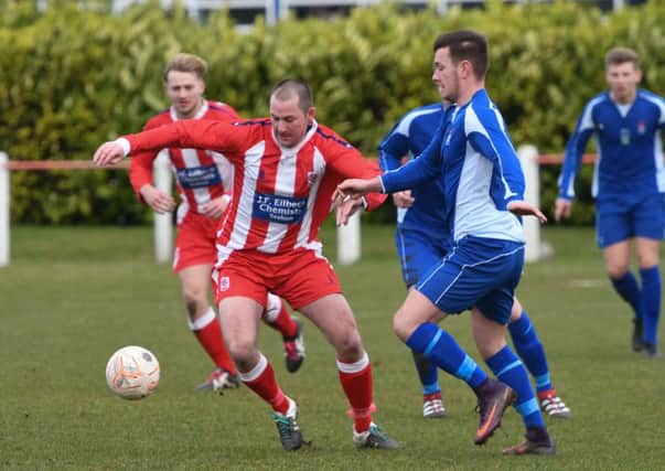 Seaham Red Star Reserves (red and white) battle in vain against Jarrow on Saturday. Picture by Kevin Brady.