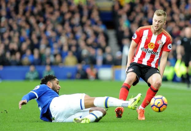 Sunderland's Seb Larsson loses out to a determined effort from Everton defender Ashley Williams. Picture by Frank Reid