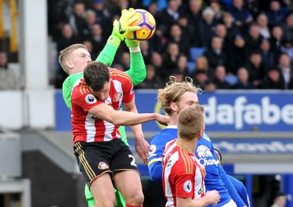 Jordan Pickford gathers a high ball under pressure at Everton. Picture by Frank Reid