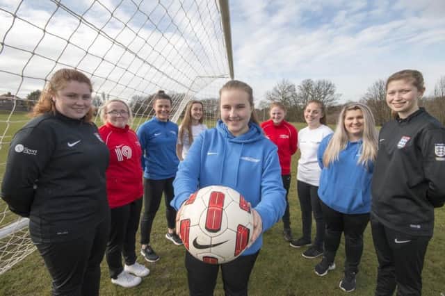 Abbie Waites (centre) is aiming to get more women into football.