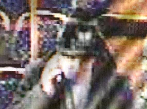 Do you recognise this man? It can't be seen clearly on the image but he is wearing an Umbro grey jumper and a black bobble hat with a white skill and cross bones motif on.