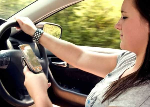 Drivers are being urged not to use their mobiles while in their car, with tougher penalties now in force.