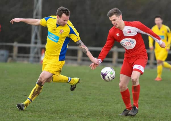 Washington (red) battle against Chester-le-Street in last week's 3-3 draw in Division One. Picture by Kevin Brady