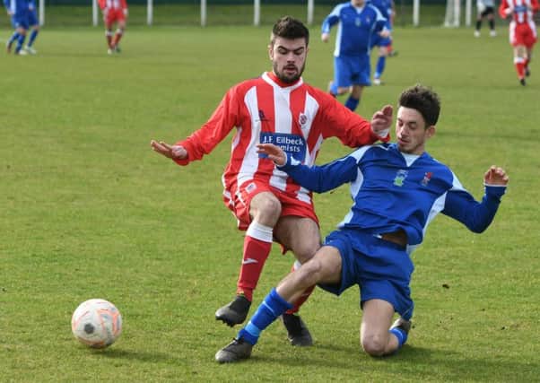 Seaham Red Star Reserves (red/white) battle against Jarrow in last week's Wearside League clash. Picture by Kevin Brady