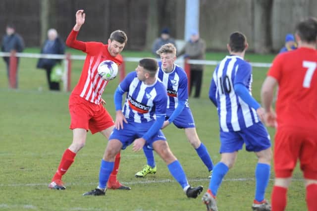 Ryhope CW (red) take on Whitley Bay in a recent Northern League clash