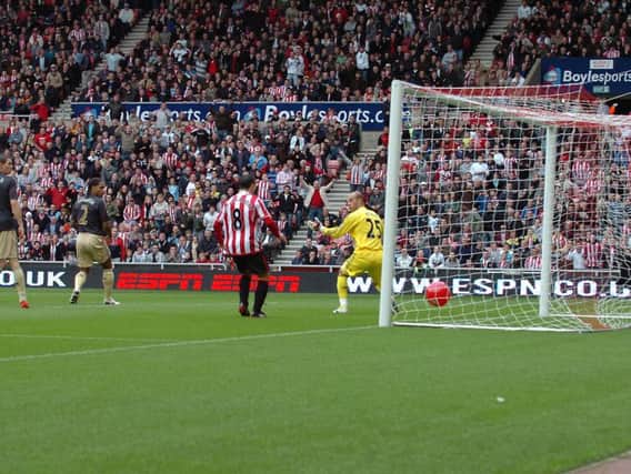Darren Bent's shot goes in off a beach ball against Liverpool