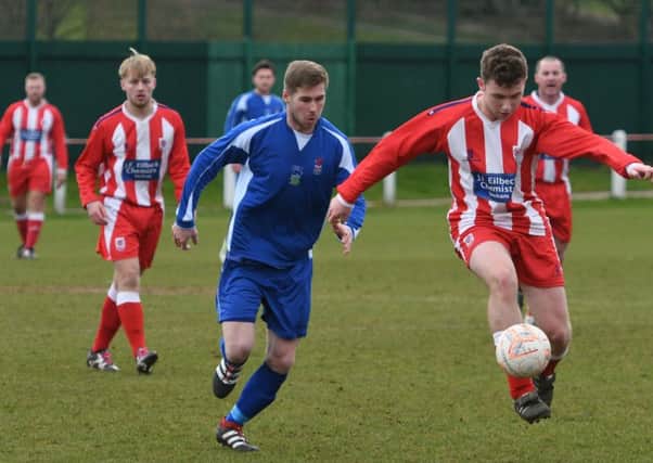 Seaham Red Star Reserves (red/white) take on Jarrow in the Wearside League last week. Picture by Kevin Brady