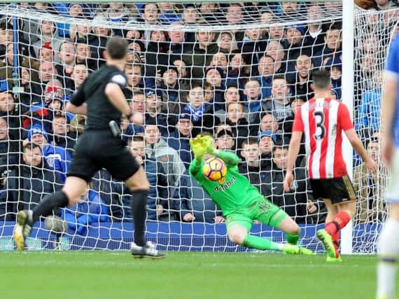 Jordan Pickford makes a save in the 2-0 defeat to Everton