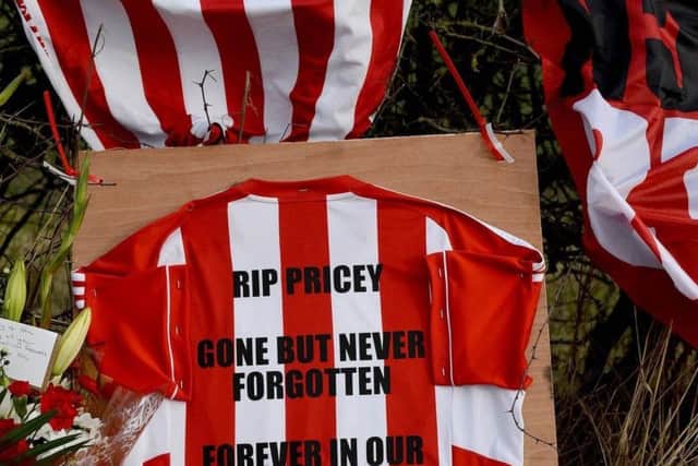 Sunderland shirts lie at the scene where cyclist Stuart Price died.