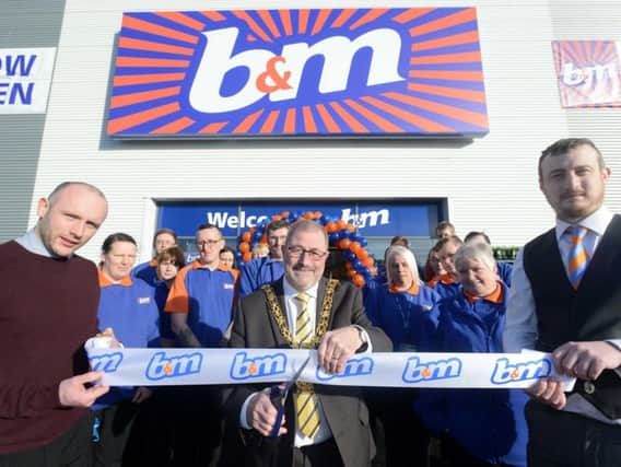 Sunderland Mayor, Coun Alan Emerson, opens the new B&M store at Pallion Retail Park, joined by deputy manager Aaron Porter (left) and store manager Andy Martin (right).