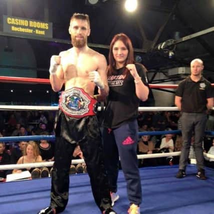 Jake Thirlaway with IKF English title belt and partner and Spartan Fighting Arts Academy team-mate Becca Garside