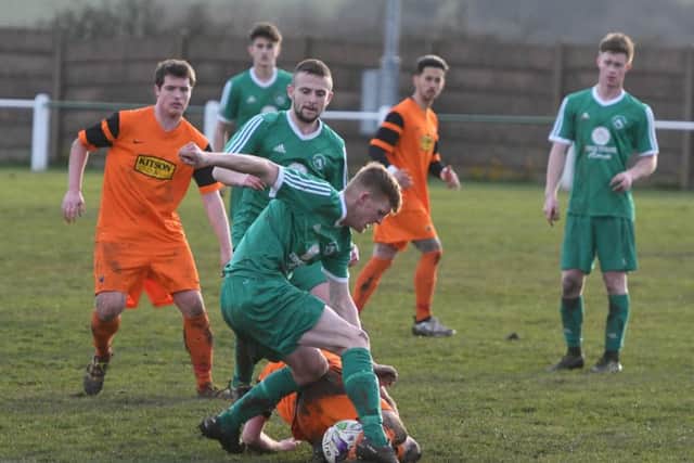 Easington Colliery (green) battle against Alnwick Town on Saturday. Picture by Kevin Brady