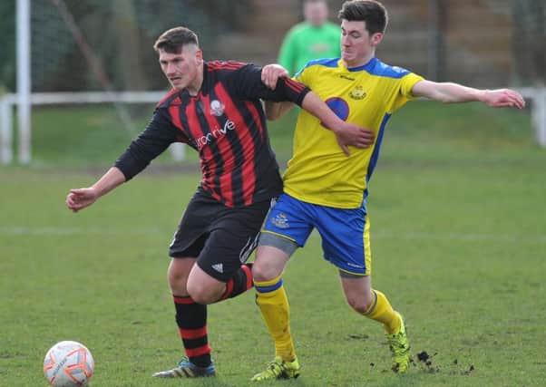 Ashbrooke Belford (black and red stripes) battle against Wolviston on Saturday. Picture by Tim Richardson
