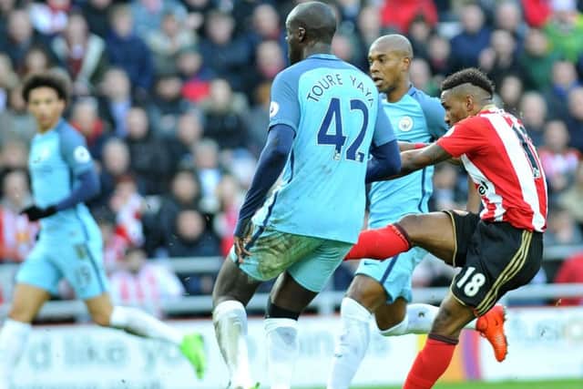 Jermain Defoe fires in a shot against Manchester City. Picture by Frank Reid