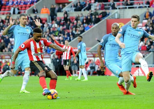 Manchester City's John Stones tries to block Jermain Defoe's shot at the Stadium of Light. Picture by Frank Reid