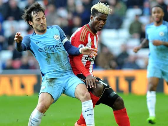 Didier Ndong and David Silva battle for the ball at the Stadium of Light