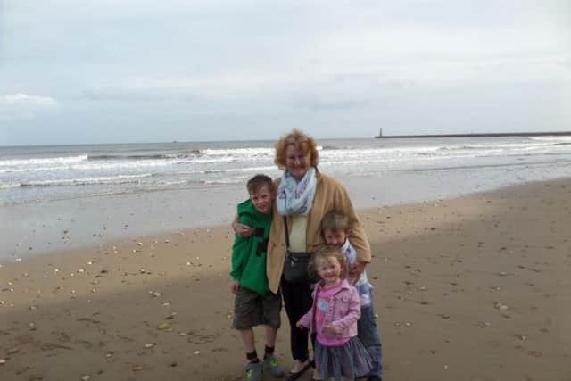 Lorna with grandchildren Cameron, Adam and Jessica