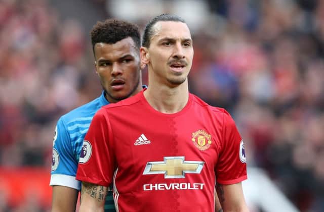 Bournemouth's Tyrone Mings (left) and Manchester United's Zlatan Ibrahimovic.