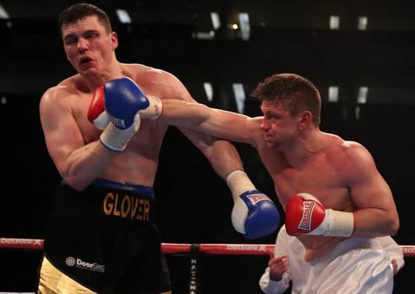 Jake Bonallie thumps back the head of Craig Glover during his pro debut. Picture: Lawrence Lustig