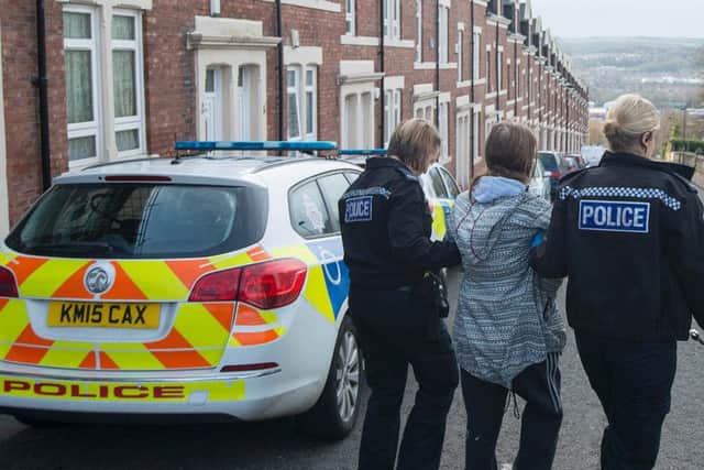 A suspect is led away by police during the 'lethal; highs' raid. Pic: Northumbria Police.