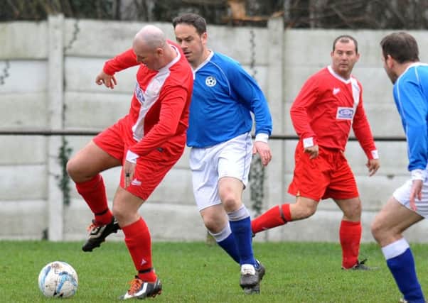 Hylton CW (red) take on Dubmire in the Over-40s League last weekend. Pictures by Tim Richardson