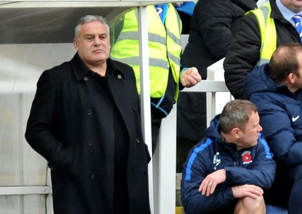 Pools boss Dave Jones surveys the scene from the dugout. Picture by Frank Reid