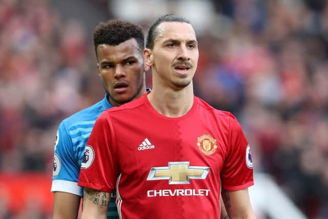 Bournemouth's Tyrone Mings (left) and Manchester United's Zlatan Ibrahimovic.