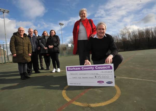 Durham County Councillors Kevin Shaw and Sonia Forster, with members of Parkside Community Centre Management Committee, who have been handed Â£35,000 towards the cost of replacing the centre's 3G pitch.