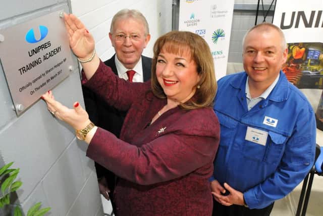 Sharon Hodgson opens the new Unipres Academy, watched by Sunderland City Council deputy leader Coun Harry Trueman and Unipres plant operations director John Cruddace