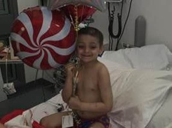 Bradley Lowery is all smiles with his gift from Sunderland AFC.