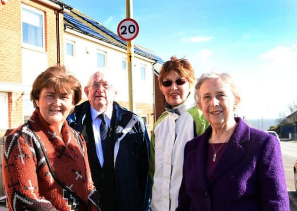 Councillors Tracey Dixon, Peter Boyack and Joyce Welsh with lead member for area management and community safety Coun Moira Smith at one of the new speed signs.