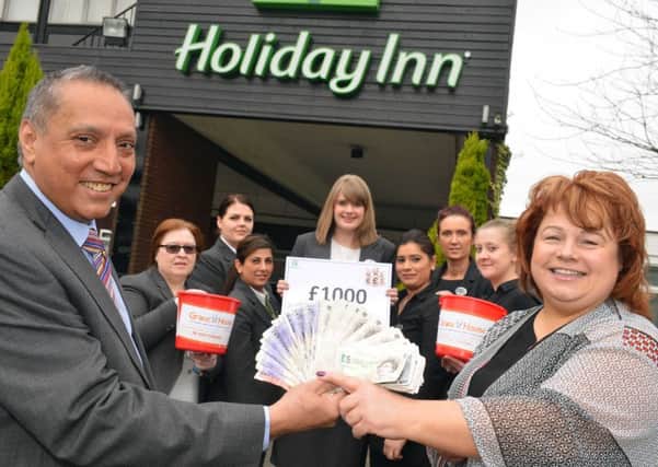 Holiday Inn fundraiser for Grace House Hotel with hotel manager Paul Mandeir and Grace House's Karen Maclennan