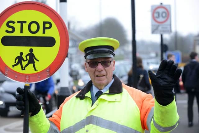 Lollipop man Fred Collier on his last shift before retirement.