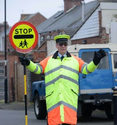 Lollipop man Fred Collier on his last shift before retirement.