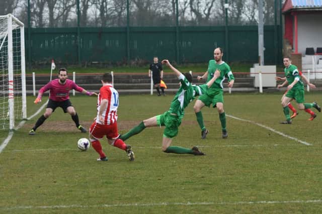 Seaham Red Star (red/white) attack against Newcastle Benfield in the Northern League on Saturday. Picture by Kevin Brady